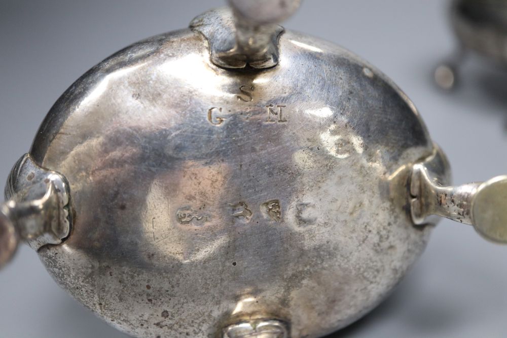 Two similar mid 18th century silver oval salts, London, 1753? and 1762, marks rubbed, length 8.5cm, 6oz.